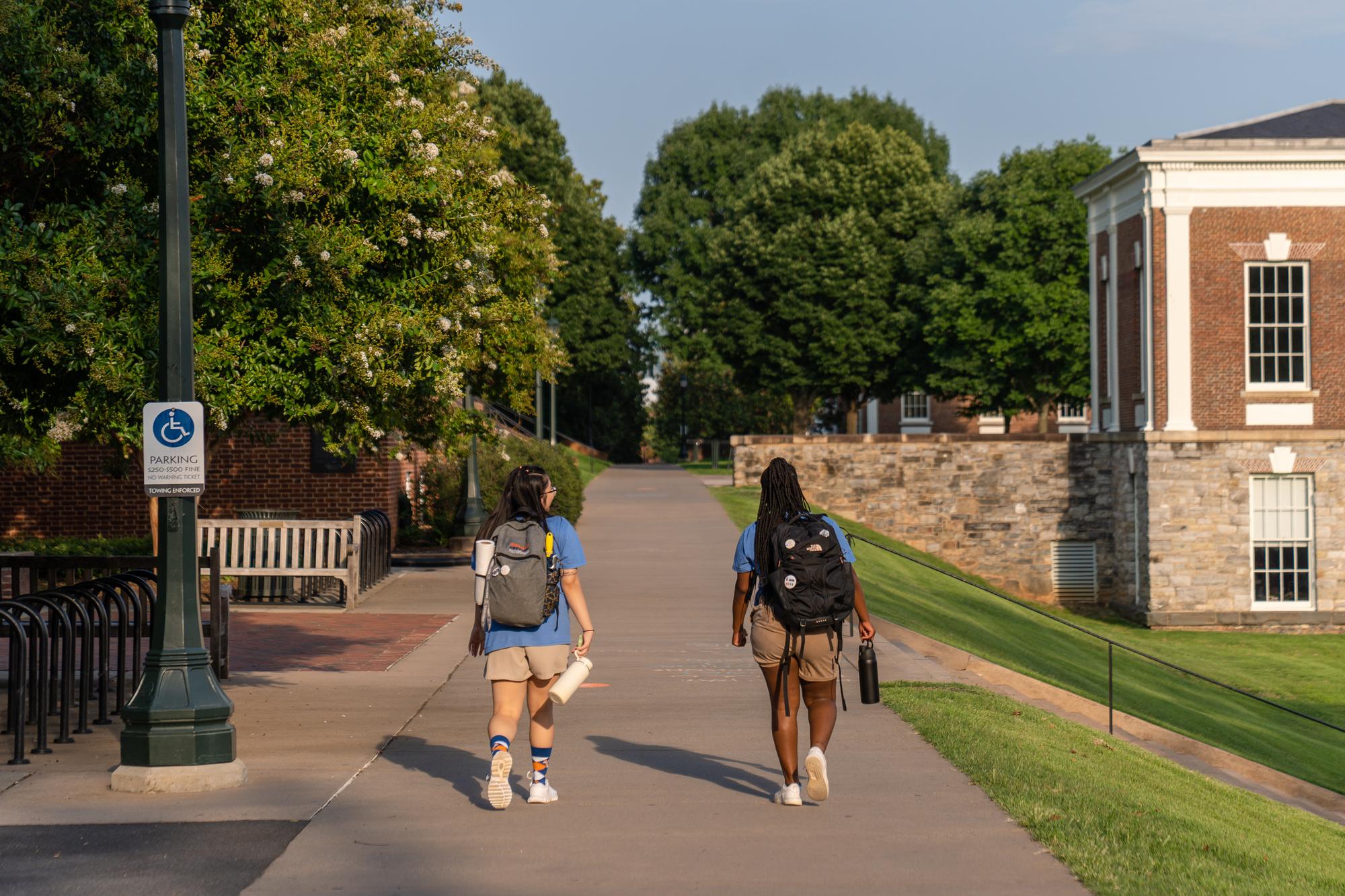 Students walking in late summer by the Amphitheater