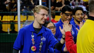 Young man highfiving